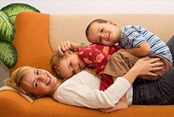 mom with kids on couch